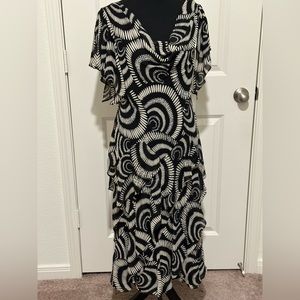 Signature by Robbie Bee lined ruffled dress with sequins sewn throughout dress.